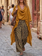 Two-piece Set Featuring An Asymmetrical Cowl-neck Top And Leopard-print Casual Trousers.